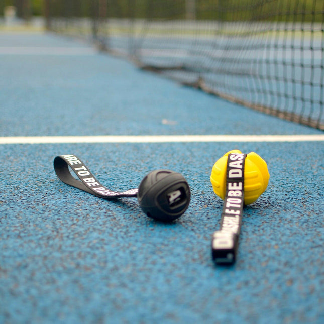 Dashi Rubber Ball - rubber tug toy for dogs, with a strap handle.